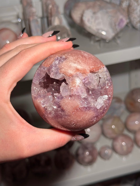 Brazilian pink amethyst x flower agate sphere with purple quartz-filled druzy cave