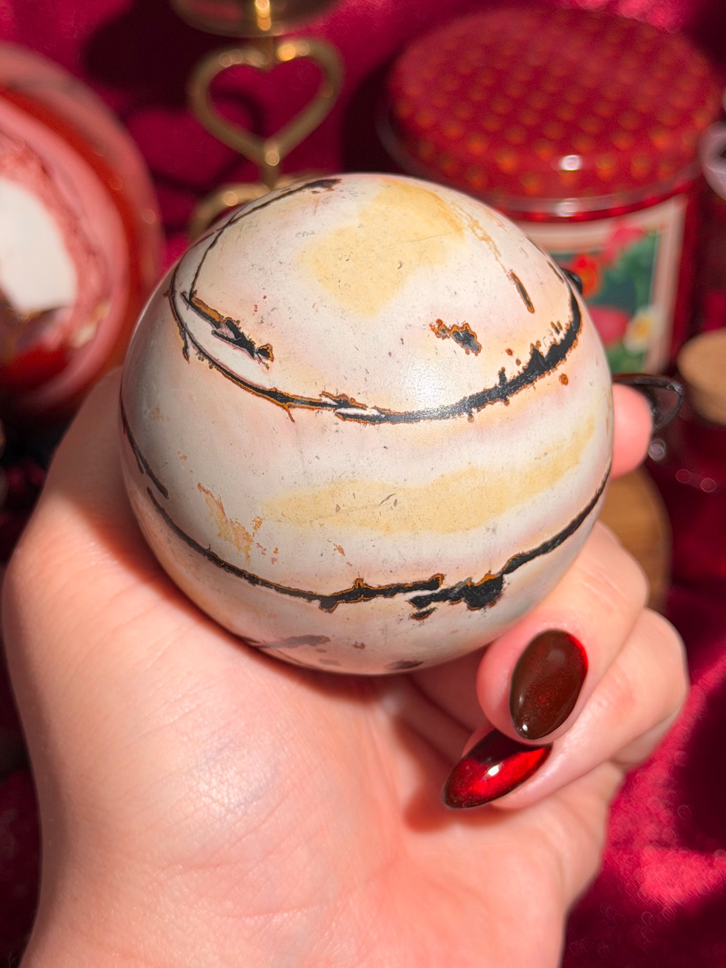 Pink and yellow Chinese picture jasper sphere with unique patterns