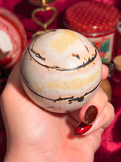 Pink and yellow Chinese picture jasper sphere with unique patterns