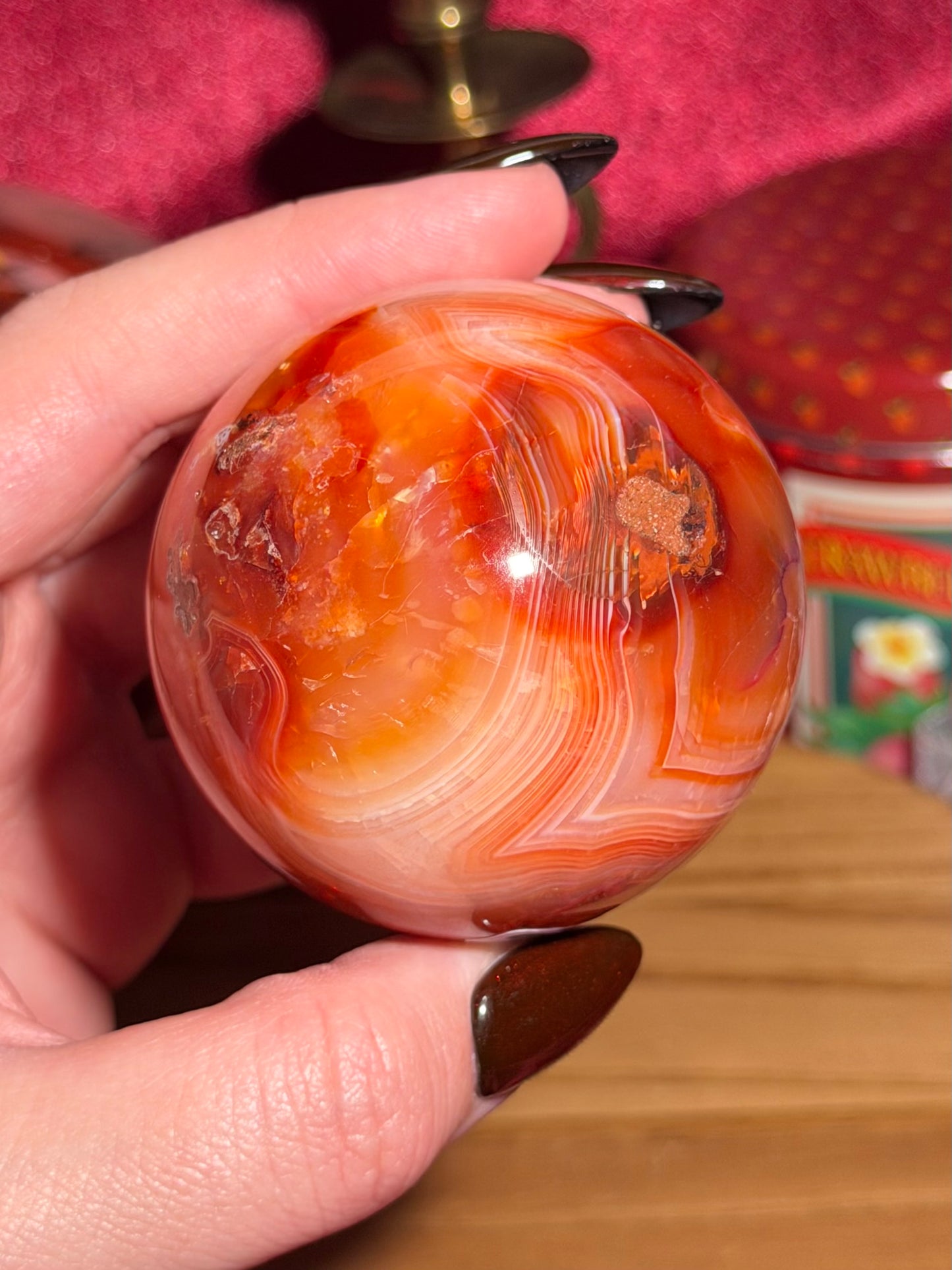 Funky banded carnelian sphere with moss inclusions