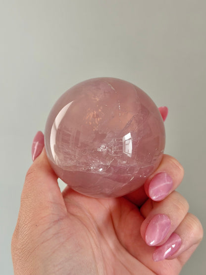 Gemmy purple-pink toned star rose quartz sphere