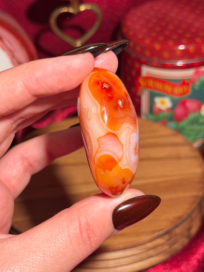 Creamsicle funky banded carnelian palmstone 11A