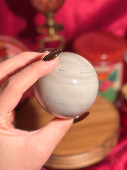 Cool grey polychrome jasper sphere with a pop of pink