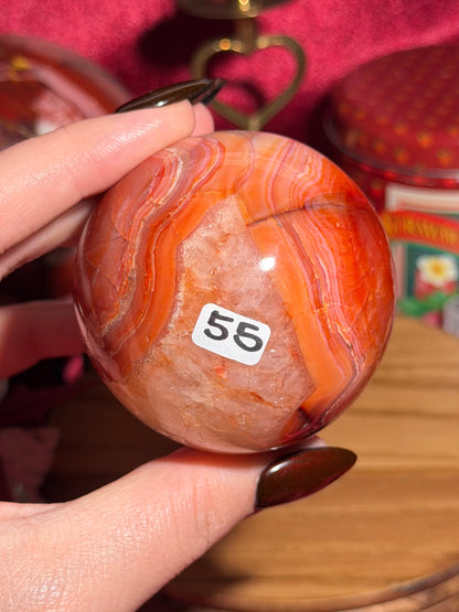 Rainbow carnelian sphere with quartz