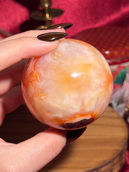 Glowy yellow carnelian sphere with imperfect fill spots