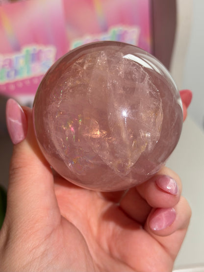 Juicy pink star rose quartz sphere with rainbows