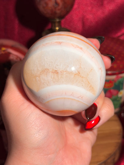 Pastel cool toned pink carnelian sphere with quartz 75mm
