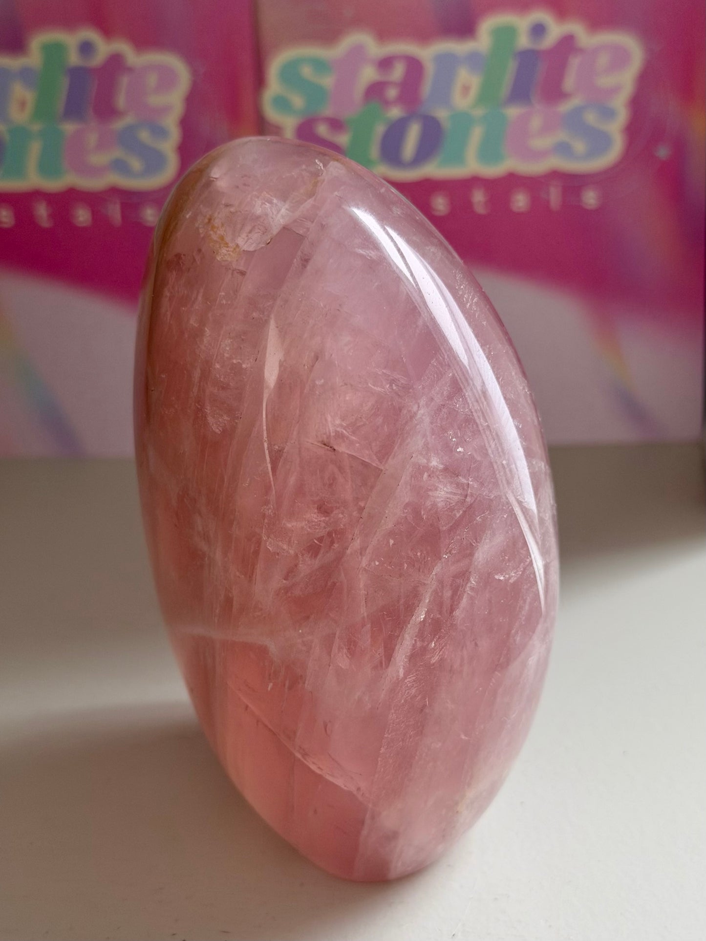 Glassy “guava” pink rose quartz freeform