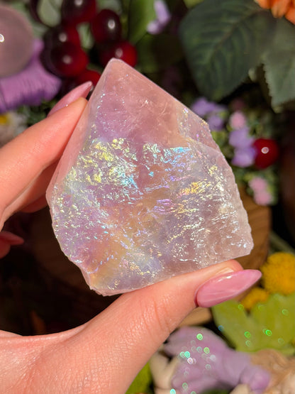 Aura coated rose quartz half polished point from Brazil
