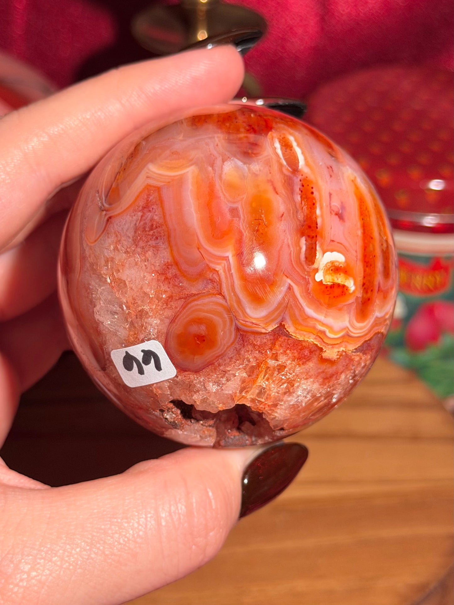Mossy carnelian sphere with quartz cave