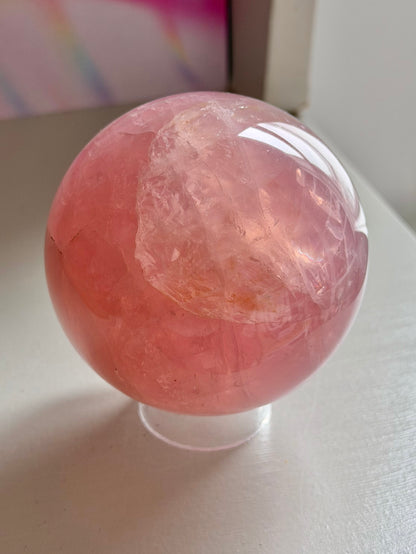 Juicy pink star rose quartz sphere with rainbows
