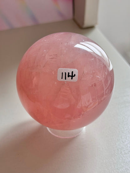 Juicy pink star rose quartz sphere with rainbows