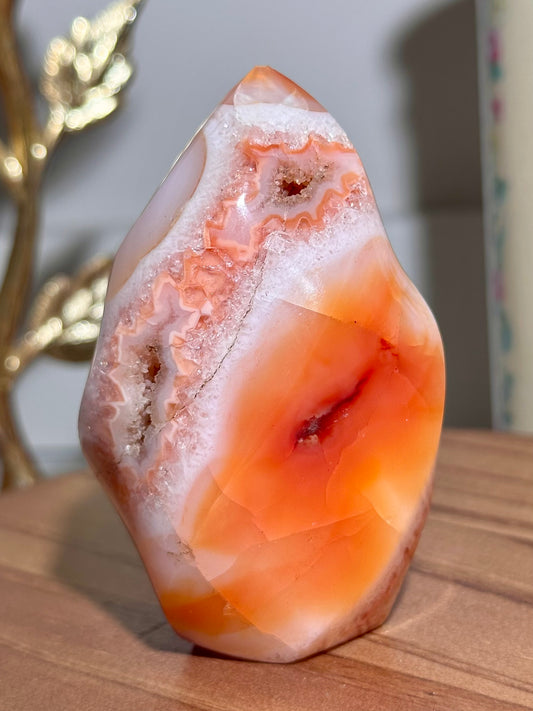 Peachy carnelian flame with quartz and natural caves