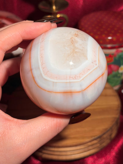 Pastel cool toned pink carnelian sphere with quartz 75mm