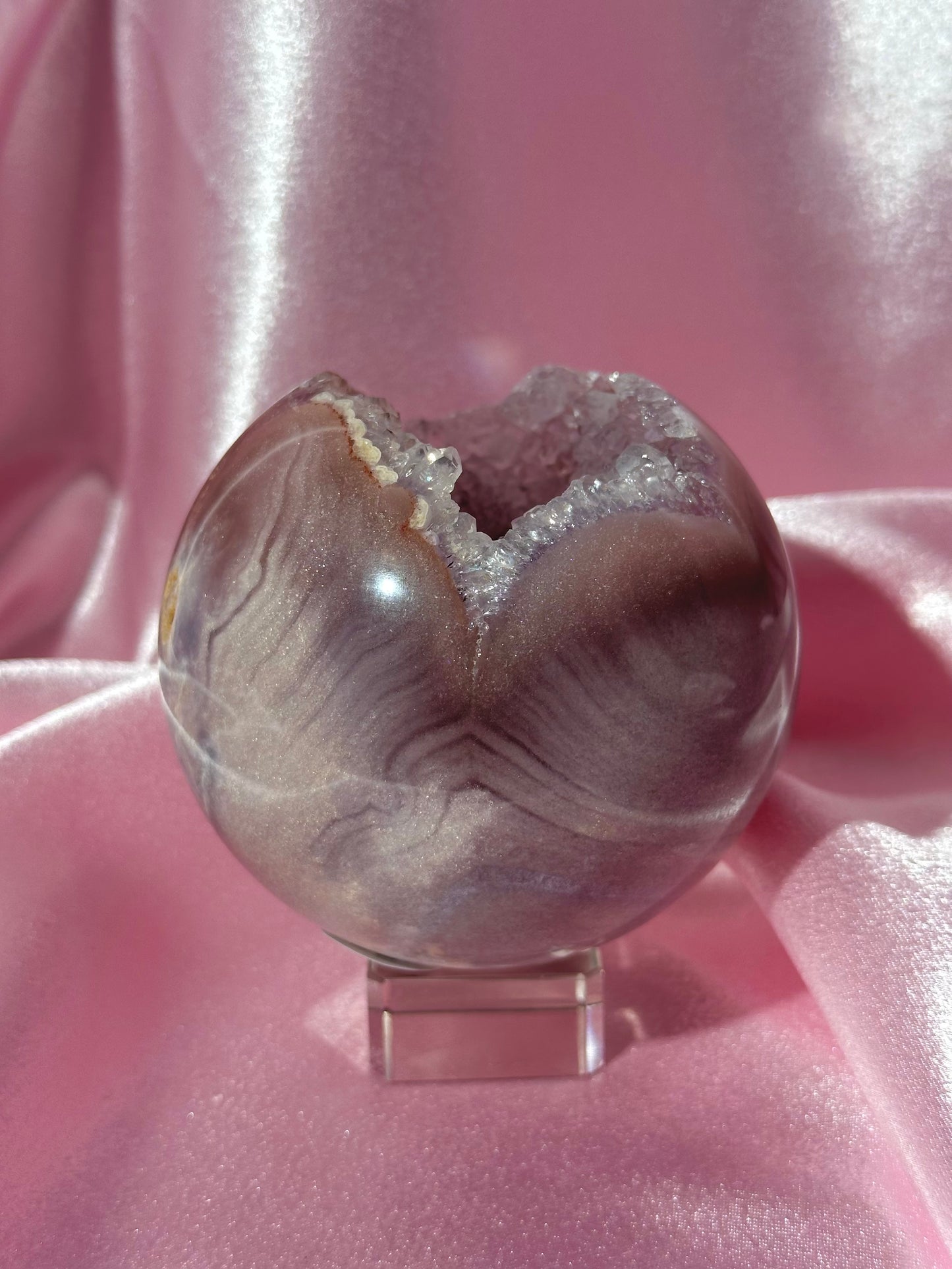 Lavender-toned glittery Brazilian pink amethyst sphere with stunning quartz cave