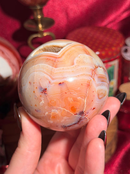 Pastel yellow and peachy toned carnelian sphere with large druzy cave 72mm