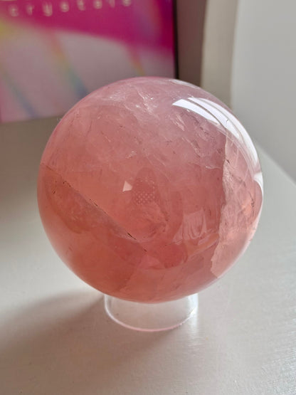Juicy pink star rose quartz sphere with rainbows