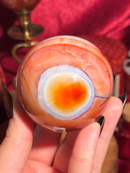 Rainbow banded carnelian sphere 65mm