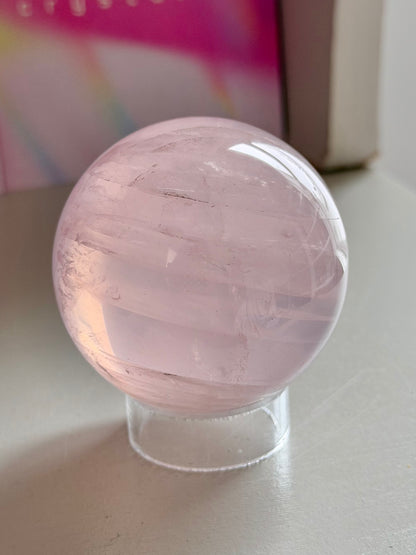 Pale pink gemmy star rose quartz sphere