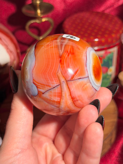Rainbow banded carnelian sphere 65mm