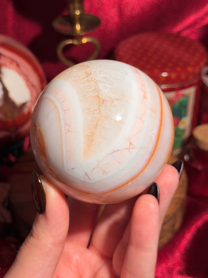 Pastel cool toned pink carnelian sphere with quartz 75mm