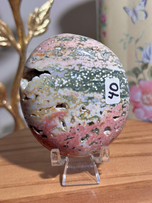 Pink rainbow Ocean jasper palmstone with bubbly druzy cave