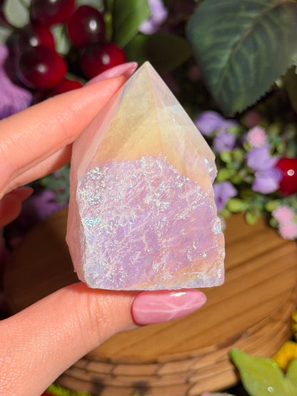 Aura coated rose quartz half polished point from Brazil