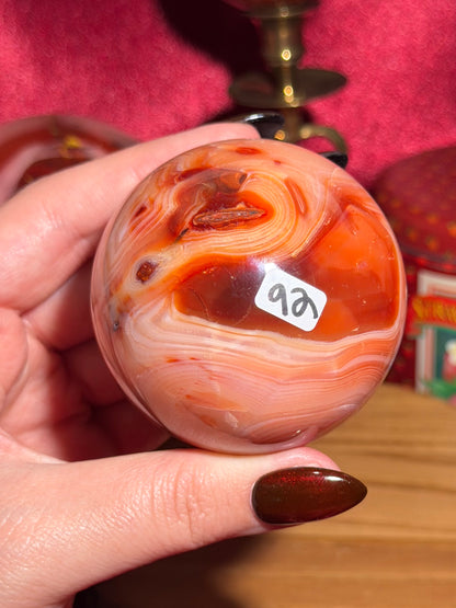 Pink banded carnelian sphere