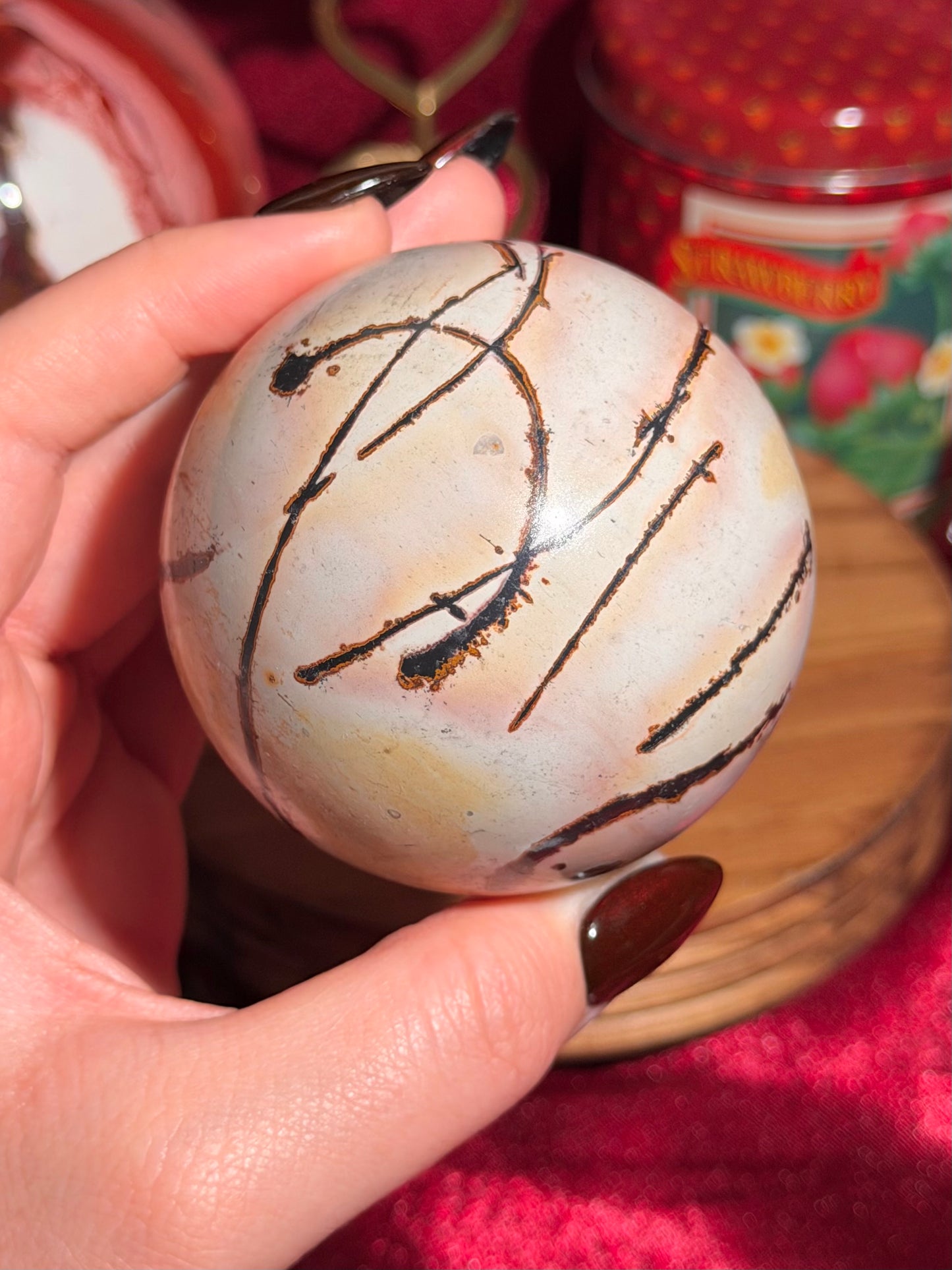Pink and yellow Chinese picture jasper sphere with unique patterns