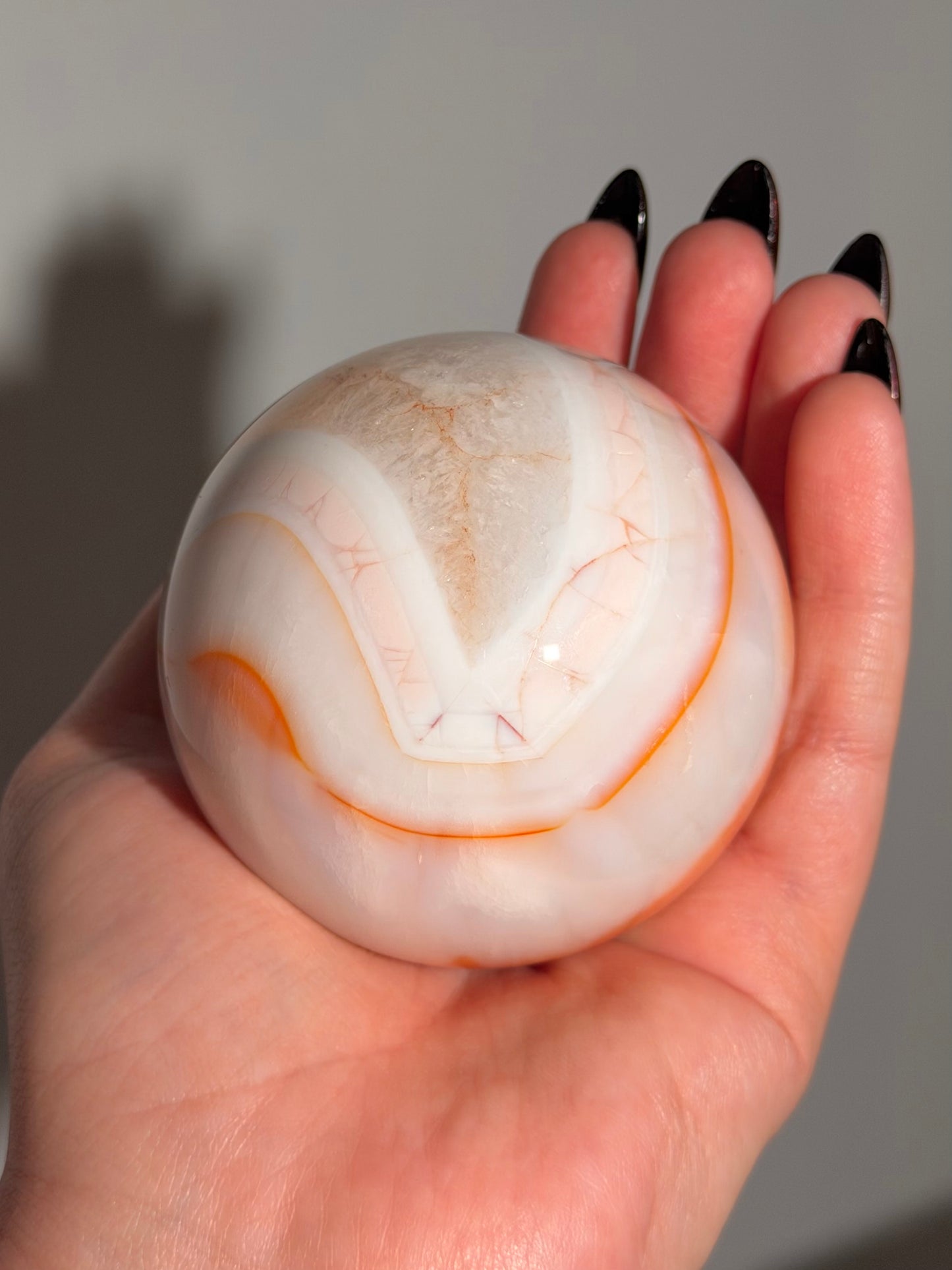 Pastel cool toned pink carnelian sphere with quartz 75mm