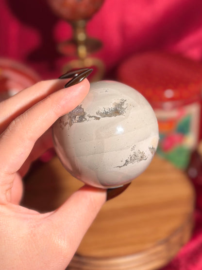 Cool grey polychrome jasper sphere with a pop of pink