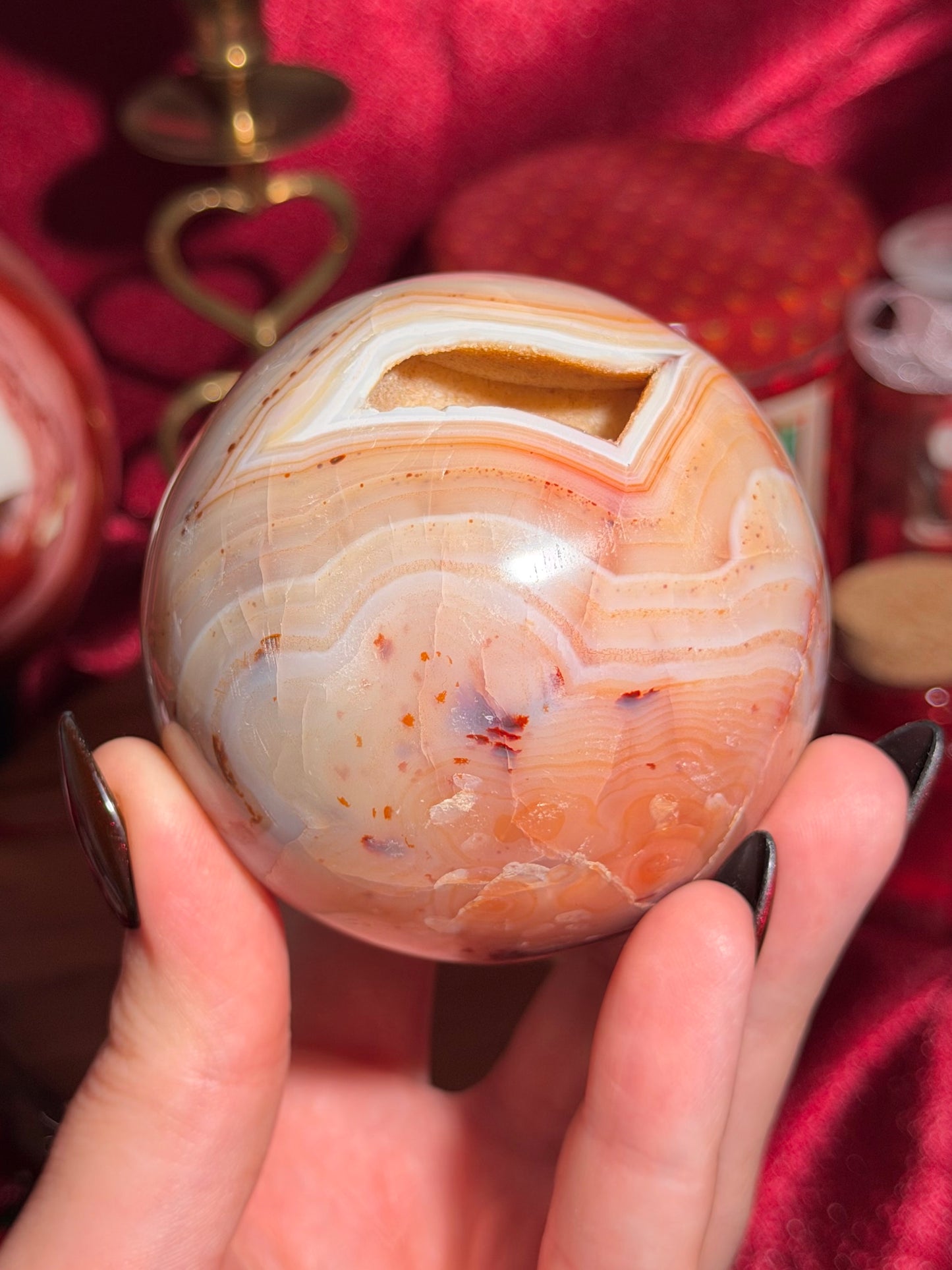 Pastel yellow and peachy toned carnelian sphere with large druzy cave 72mm