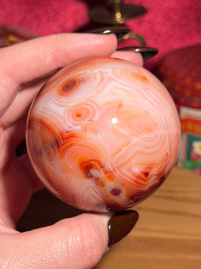 Pink banded carnelian sphere