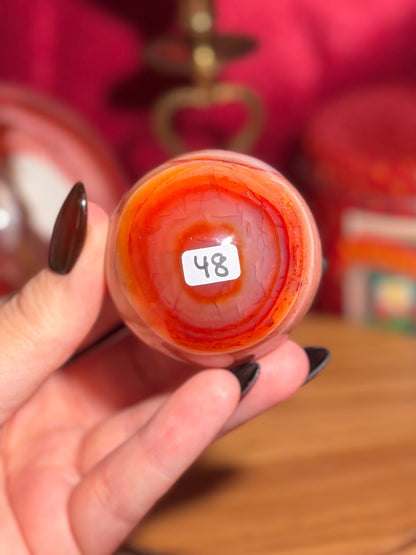 Pink banded carnelian sphere