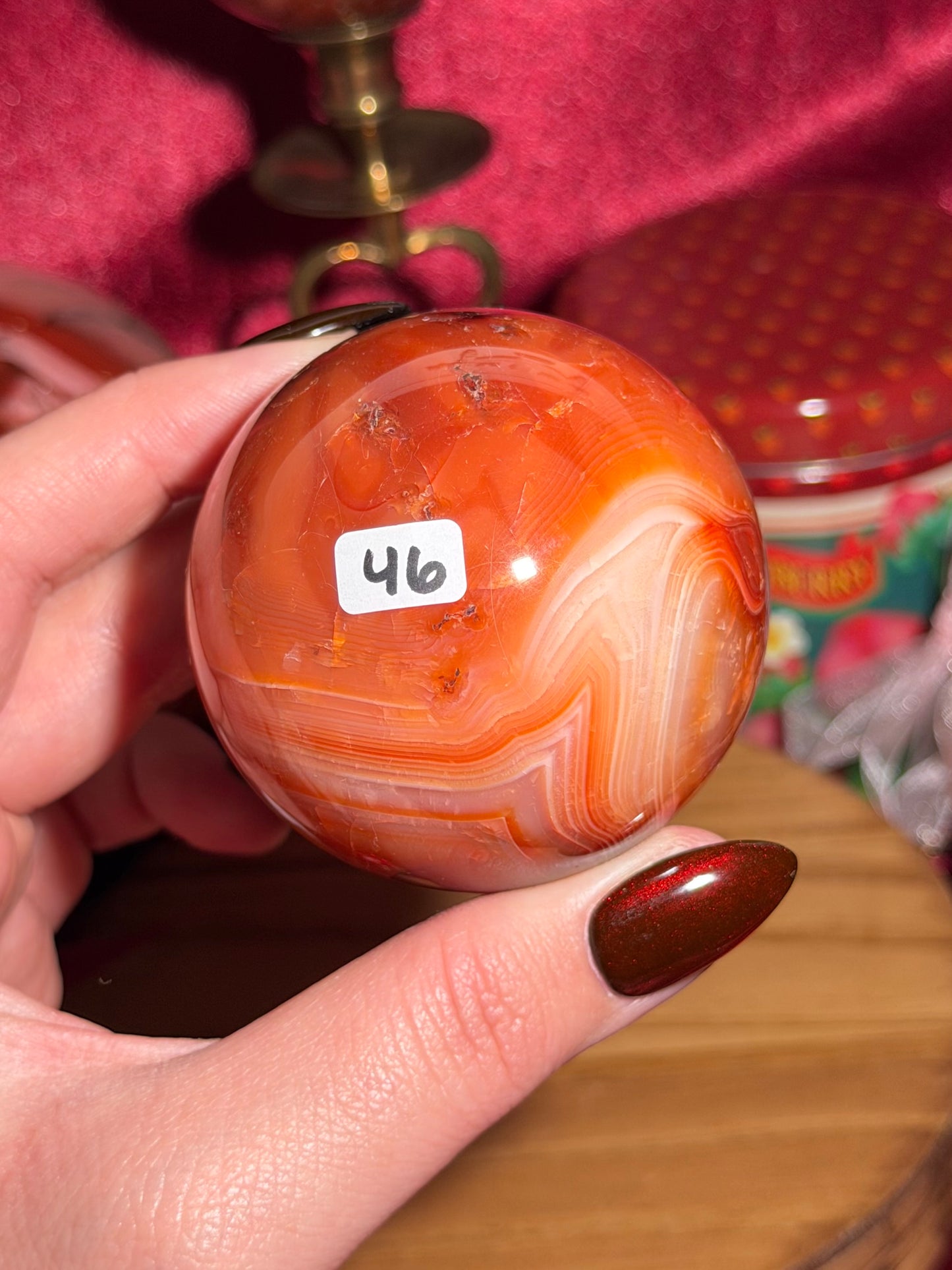 Funky banded carnelian sphere with moss inclusions