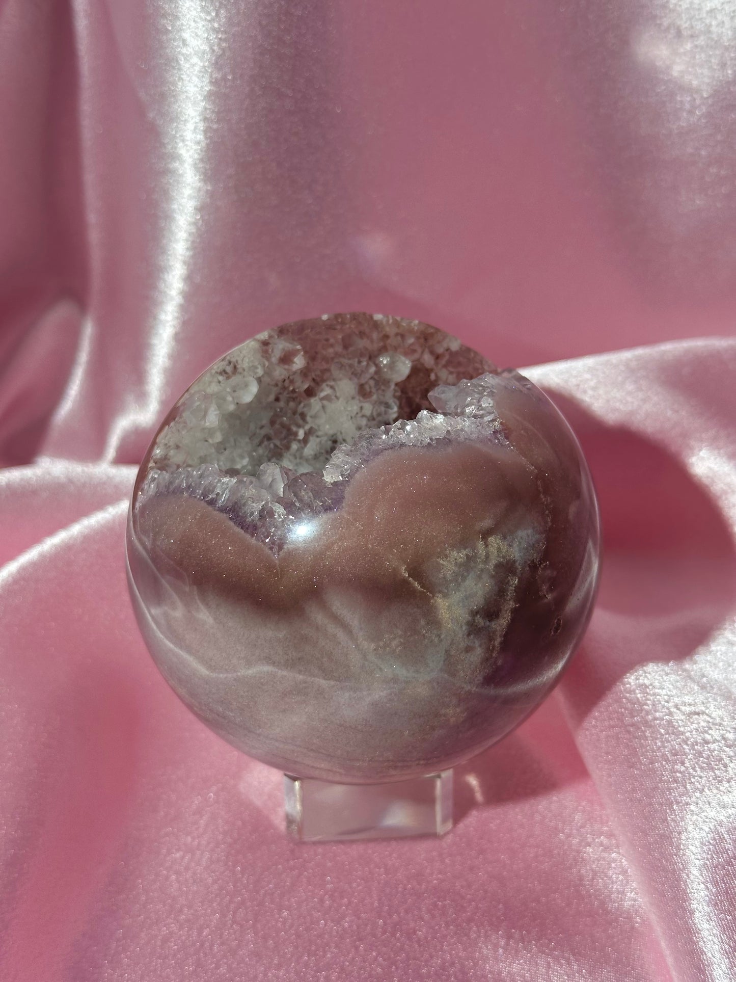 Lavender-toned glittery Brazilian pink amethyst sphere with stunning quartz cave