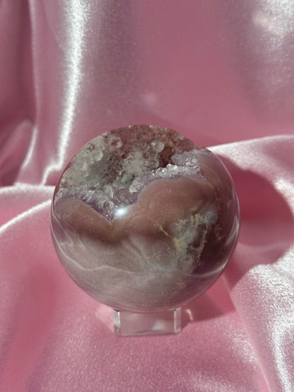 Lavender-toned glittery Brazilian pink amethyst sphere with stunning quartz cave