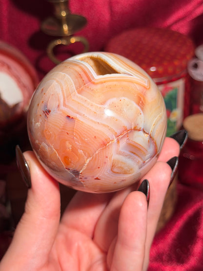 Pastel yellow and peachy toned carnelian sphere with large druzy cave 72mm