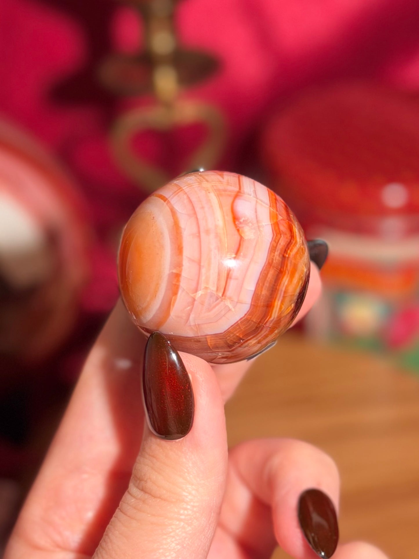 Peachy pink carnelian sphere