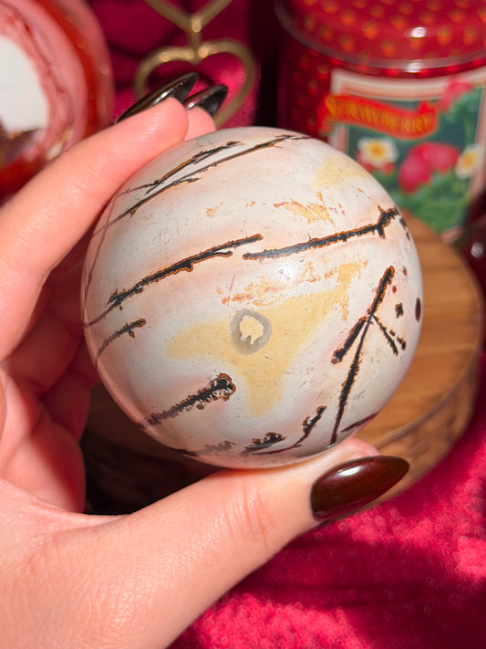 Pink and yellow Chinese picture jasper sphere with unique patterns