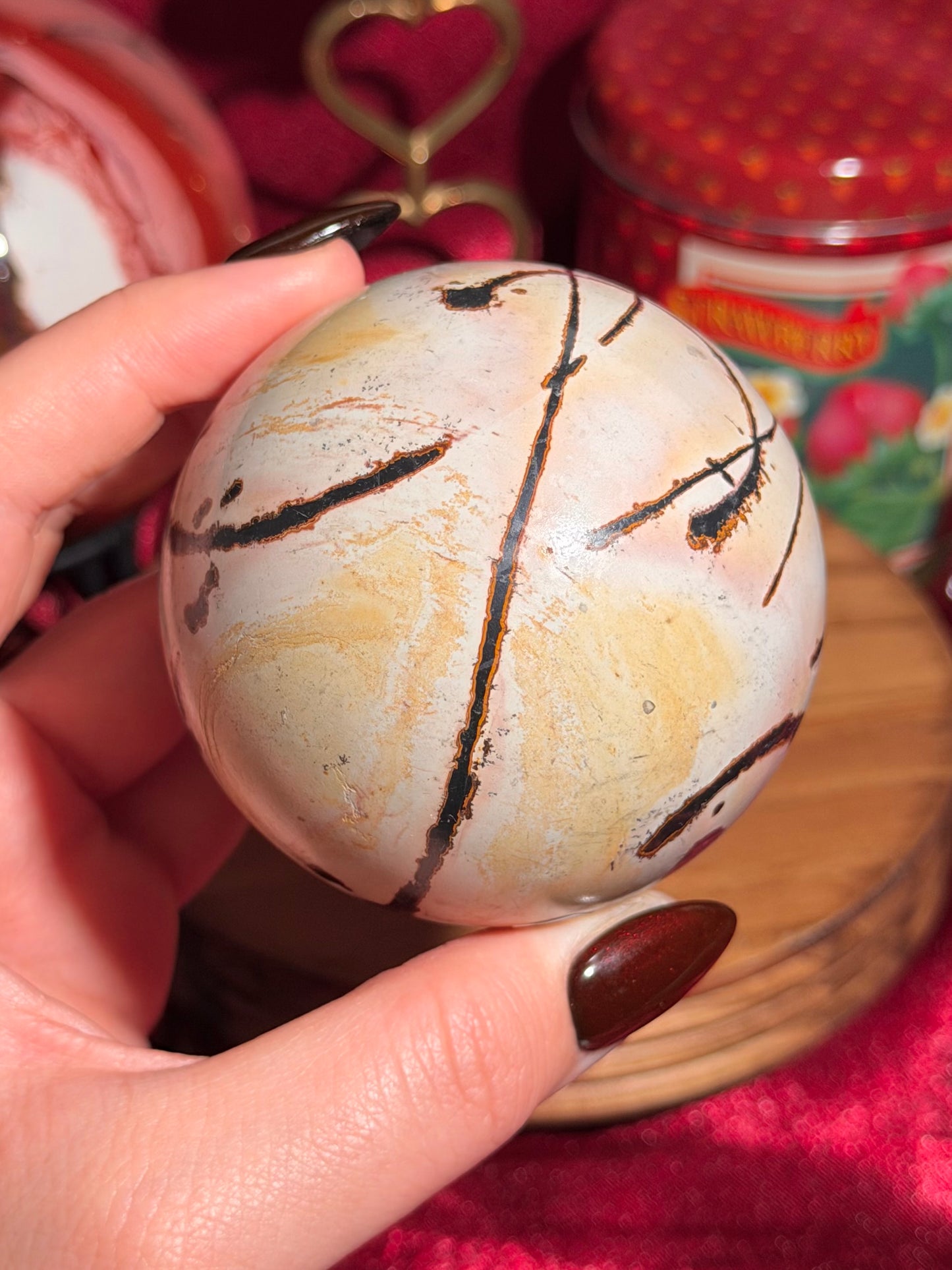 Pink and yellow Chinese picture jasper sphere with unique patterns