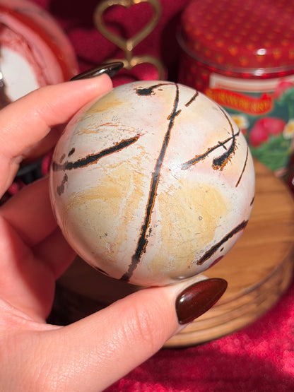 Pink and yellow Chinese picture jasper sphere with unique patterns
