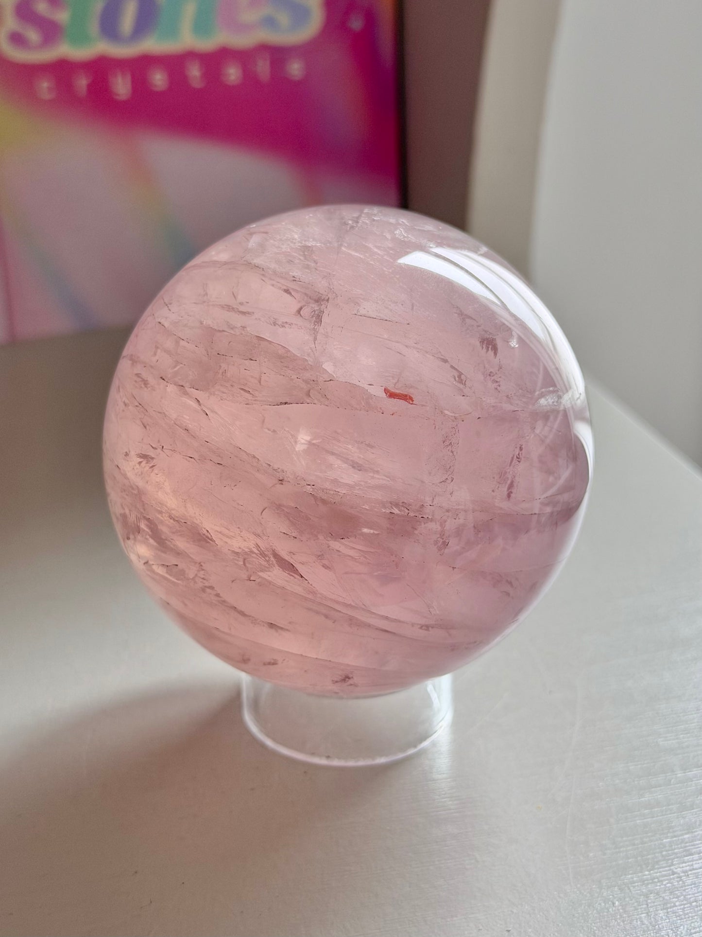 Pink gemmy star rose quartz sphere