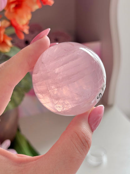 Pale pink gemmy star rose quartz sphere