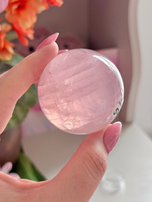 Pale pink gemmy star rose quartz sphere