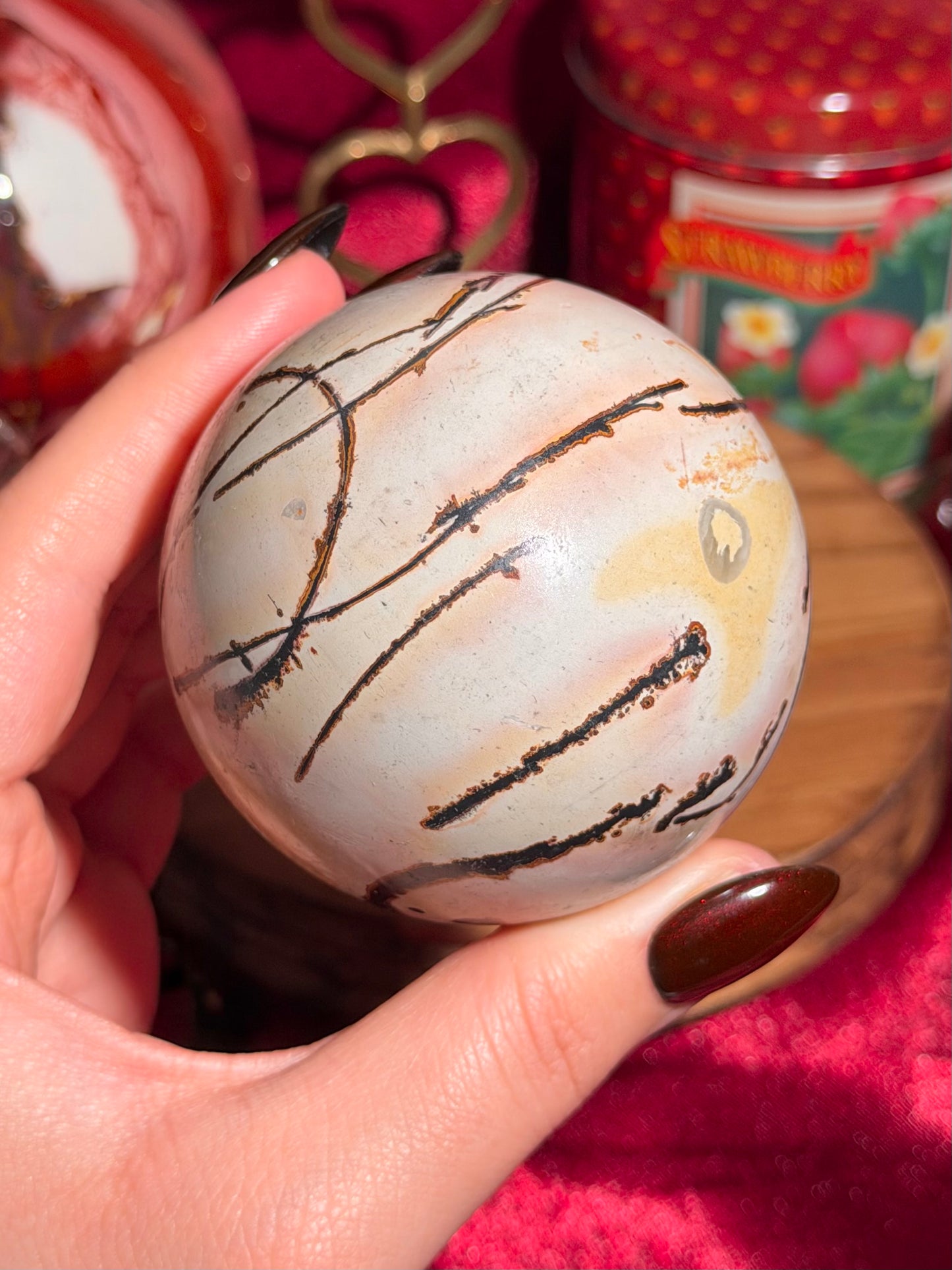 Pink and yellow Chinese picture jasper sphere with unique patterns