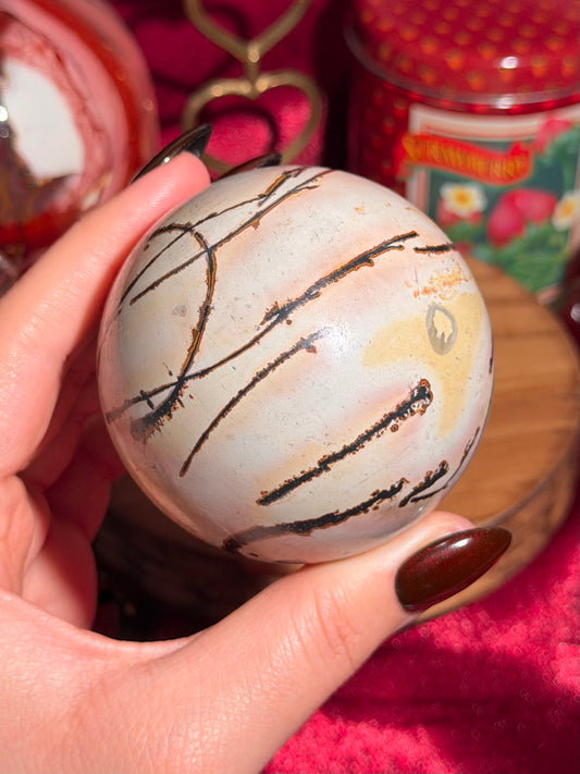 Pink and yellow Chinese picture jasper sphere with unique patterns