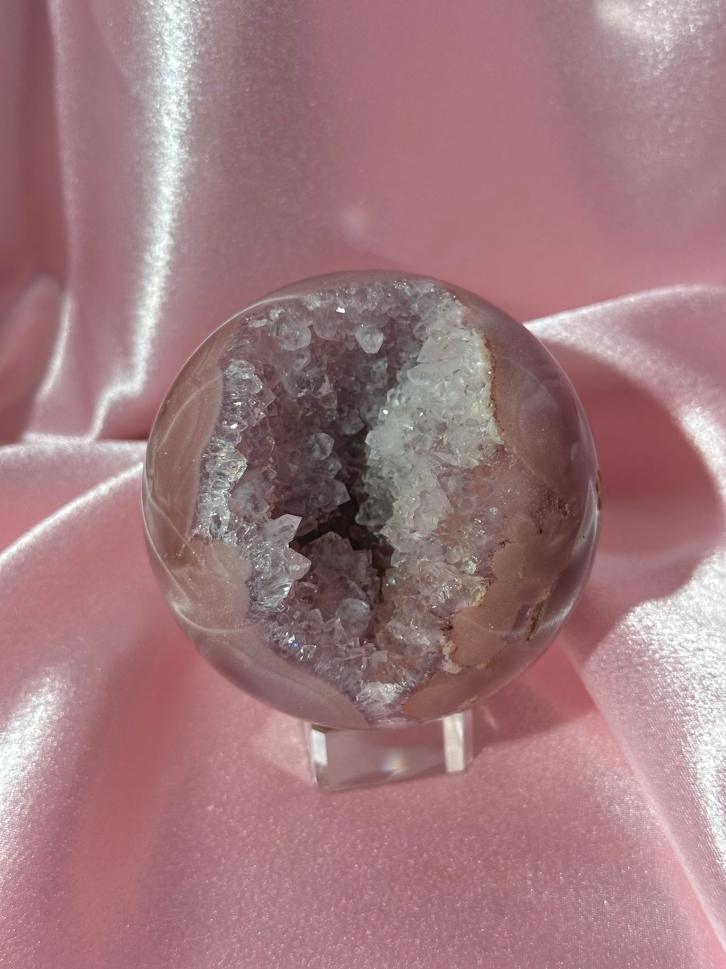 Lavender-toned glittery Brazilian pink amethyst sphere with stunning quartz cave