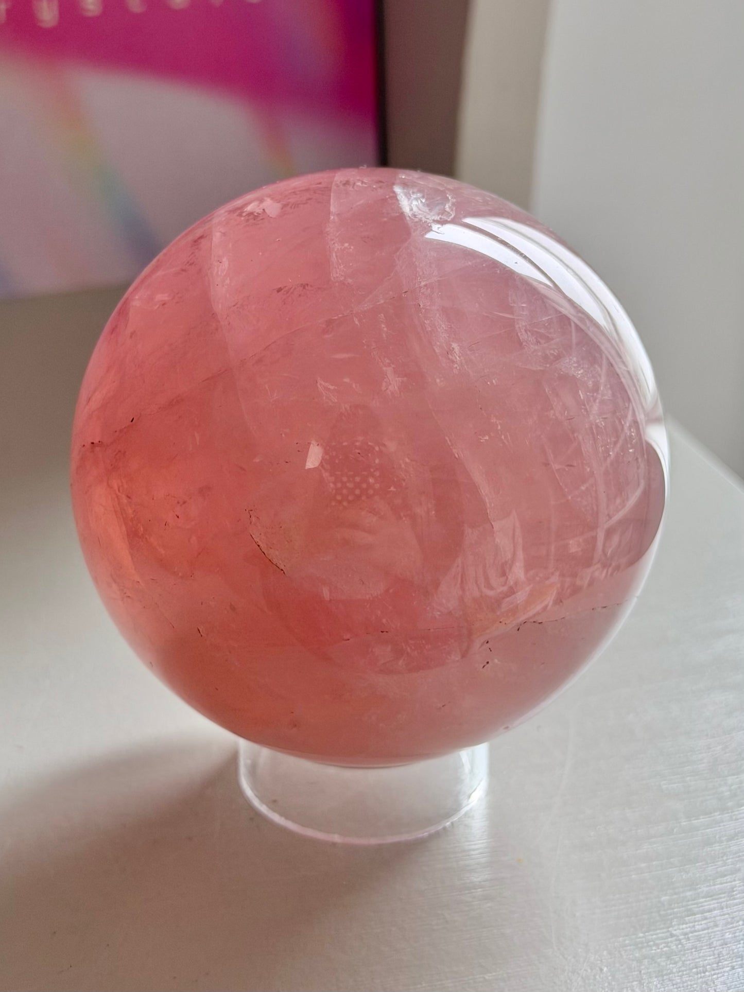 Juicy pink star rose quartz sphere with rainbows