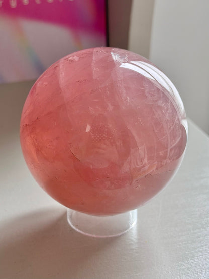 Juicy pink star rose quartz sphere with rainbows